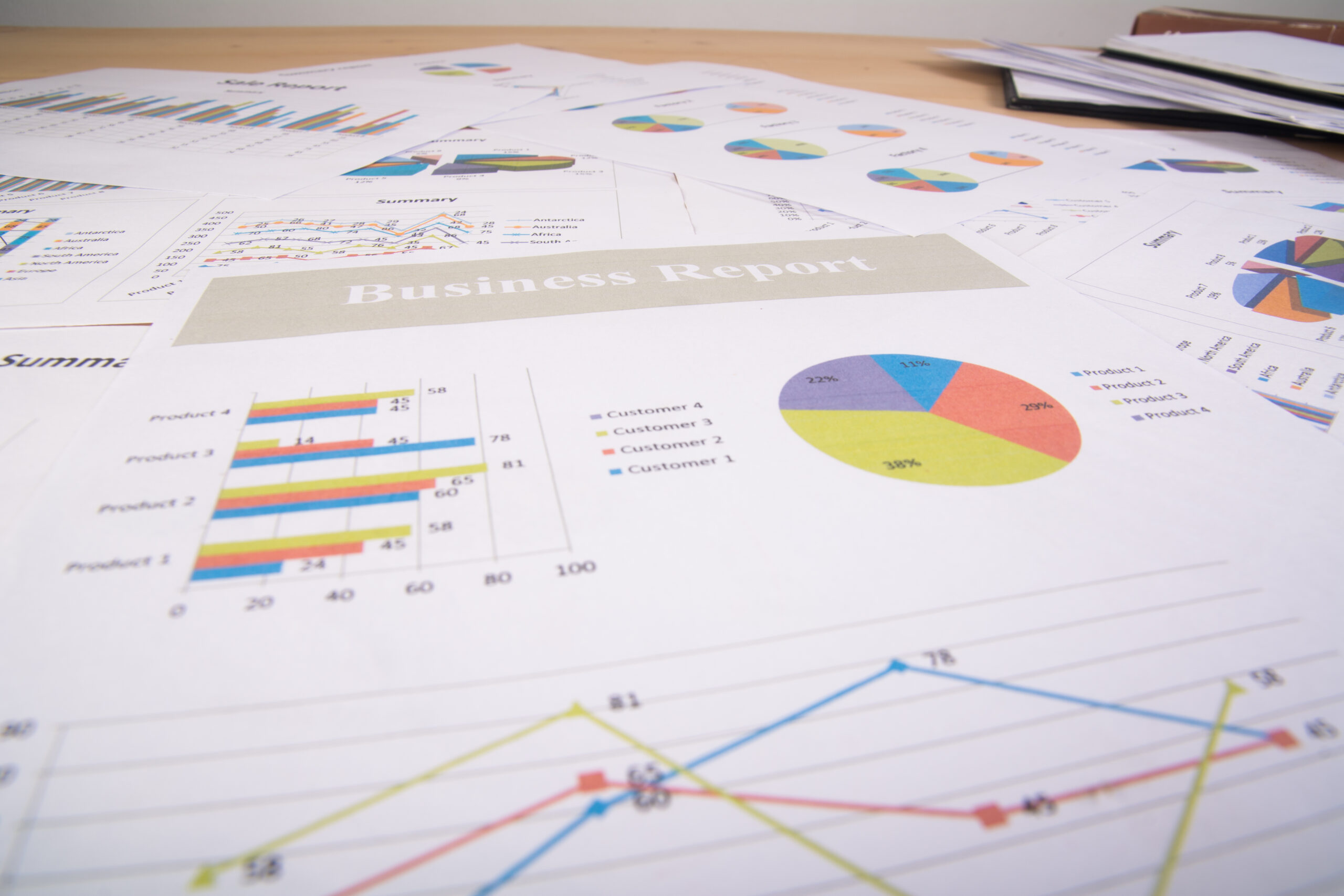 Business report. Graphs and charts. Business reports and pile of